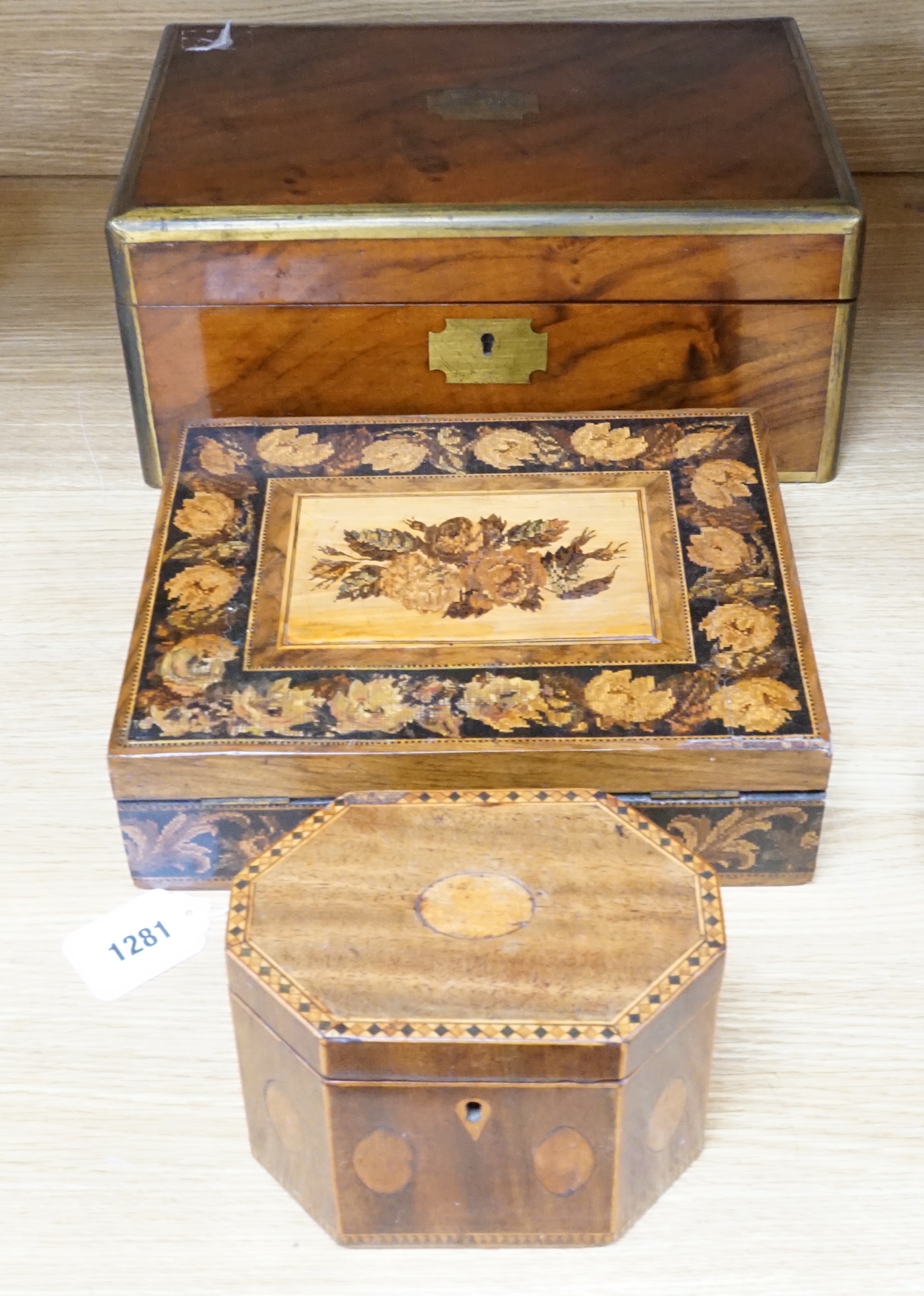 A walnu brass bound writing slope, an octagonal inlaid tea caddy and a Tunbridgeware box, 26cm wide, 22cm deep